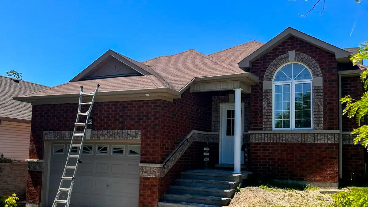 New architectural asphalt roof with crisp hip and ridge lines on a Kawartha Lakes home