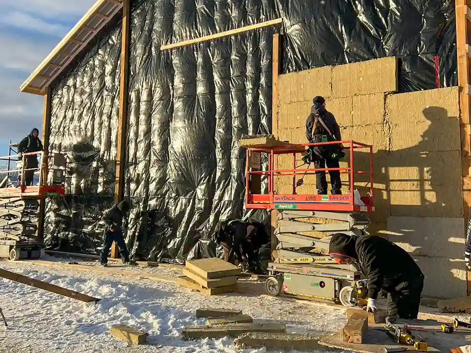 Bullarco crew installing exterior wall systems on a winter job site
