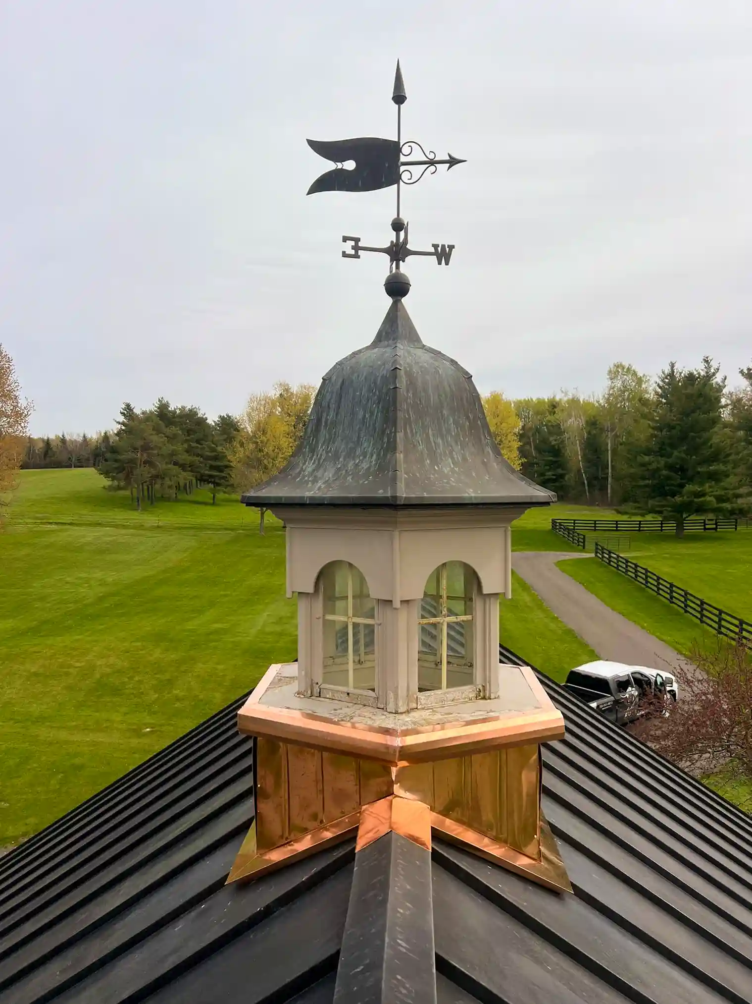 Copper cupola aged to full verdigris patina with weather vane