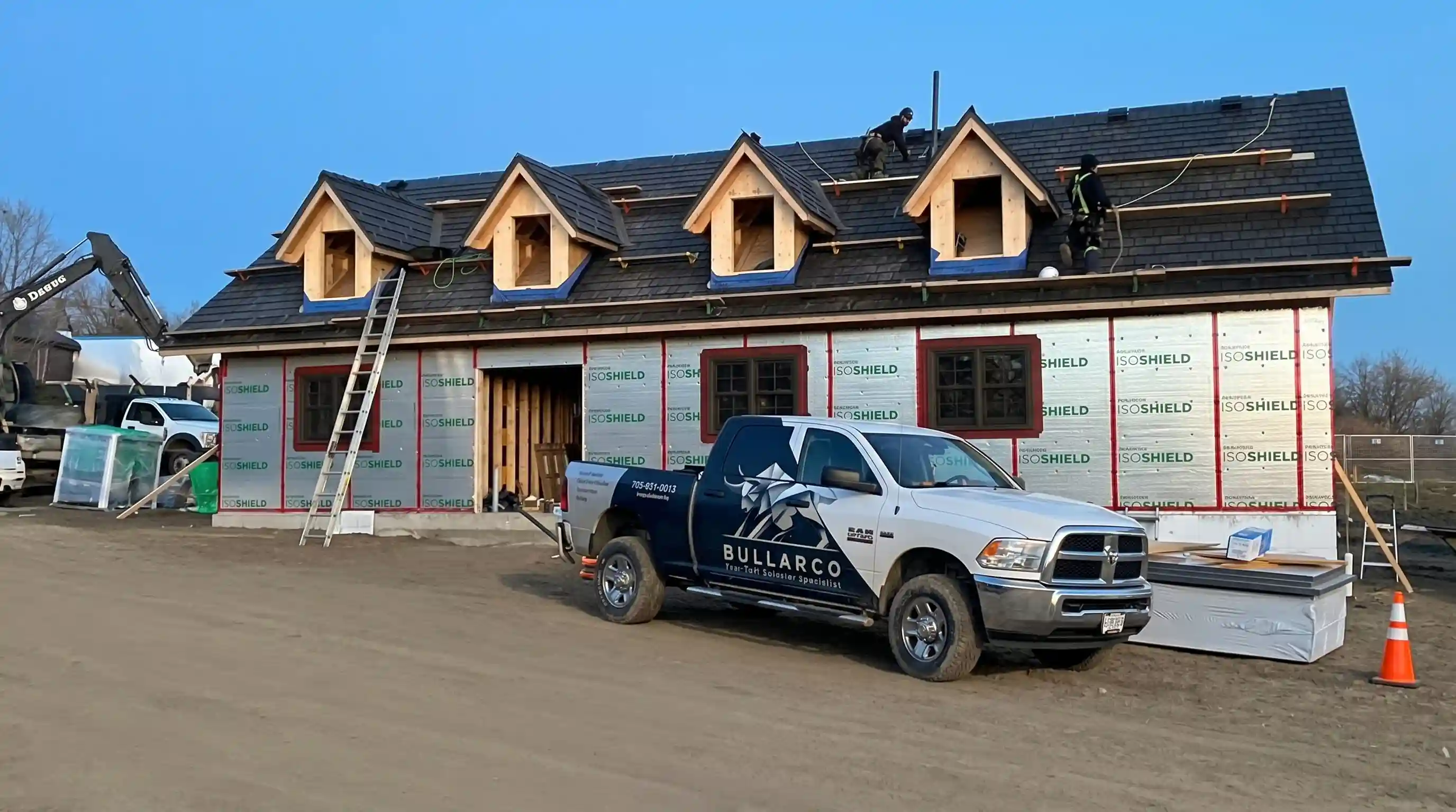 Full home re-roof in progress with Enviroshake composite shakes and a Bullarco truck on-site