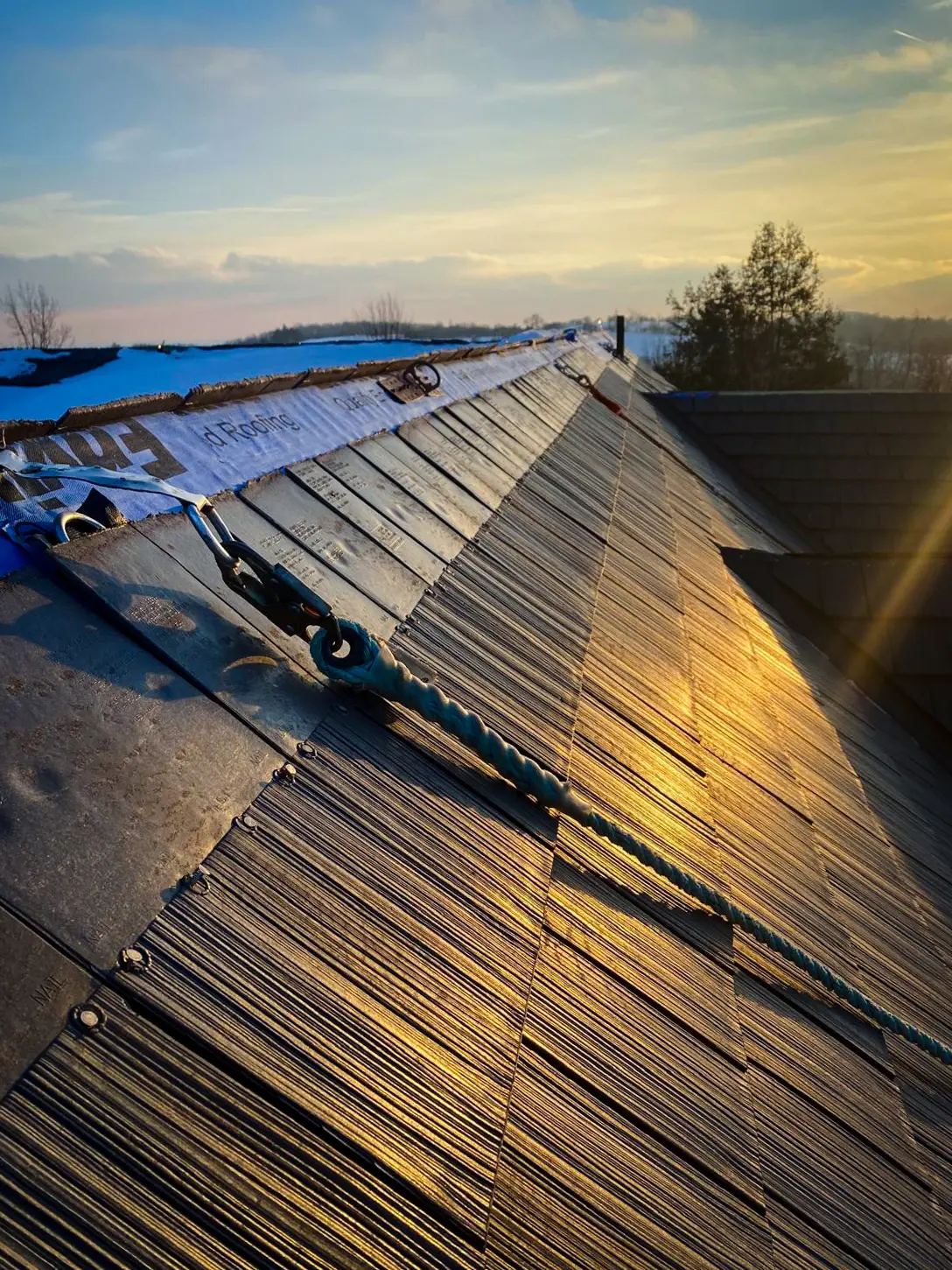 Enviroshake composite shake roof in golden evening light during installation by Bullarco